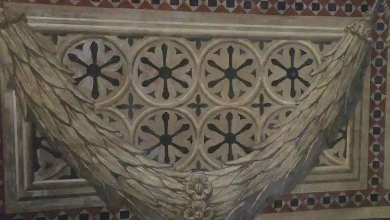 Siena cathedral interior, six six-point solar discs